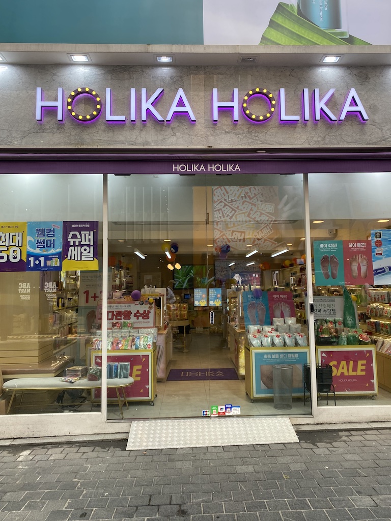 A view from outside the HOLIKA HOLIKA cosmetic storefront.